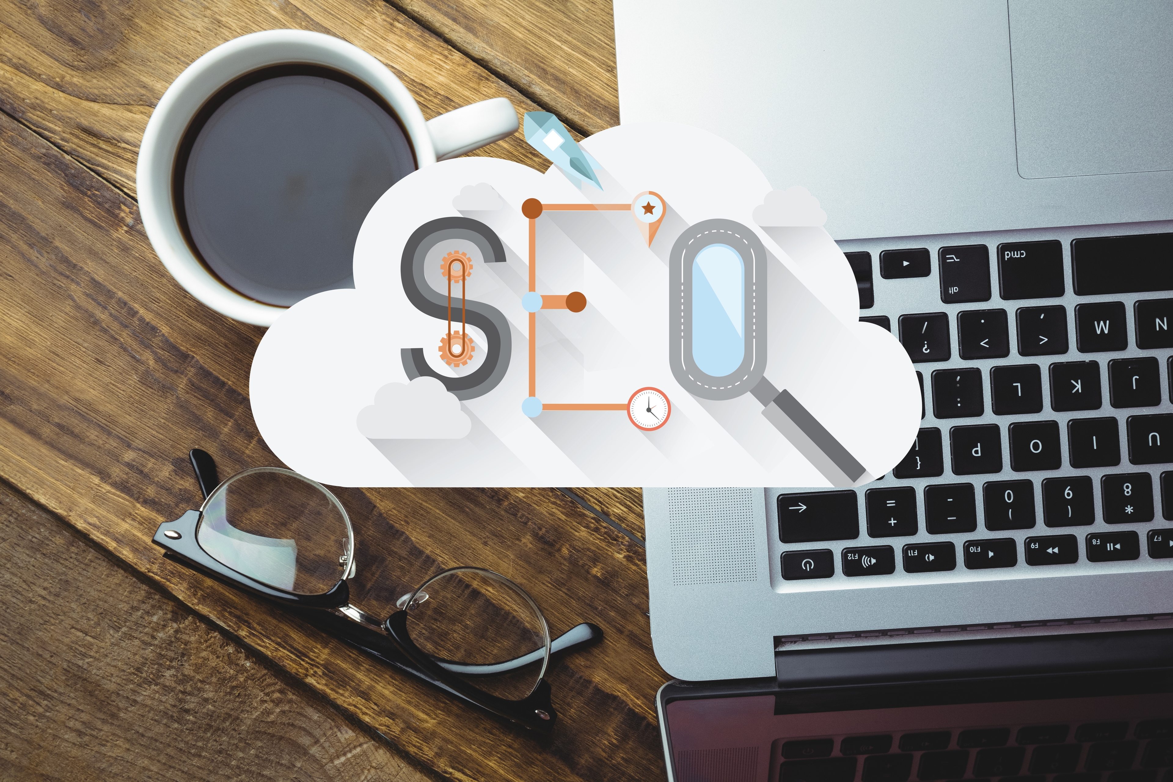 Representação do termo SEO com um notebook ao fundo